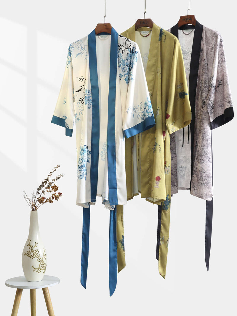 Bamboo Short Kimono Robe | Anya Lust Luxury Robes for Women | Bamboo Flower satin robe featuring botanical print and wide sleeves in vibrant blue detail